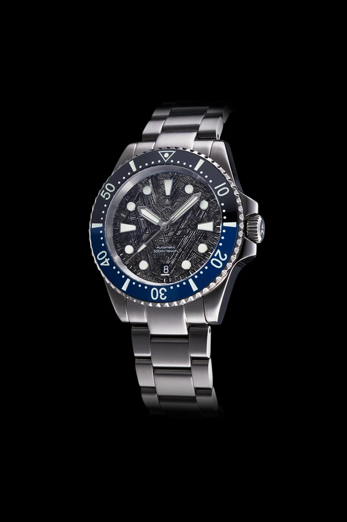 The Axios Ironclad Ocean Gulf Meteorite features a blue-black ceramic bezel complemented by a unique meteorite dial and finished with double domed Sapphire crystal glass.